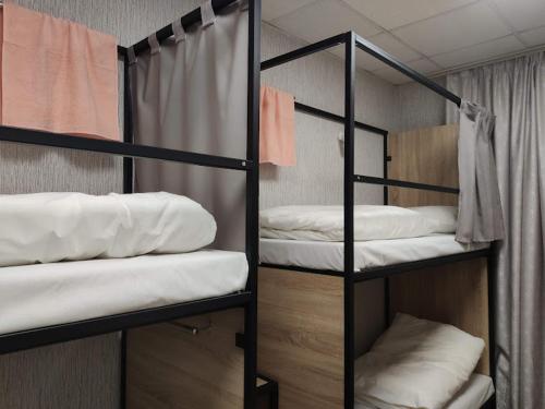 Postel nebo postele na pokoji v ubytování STAR CITY Hostel