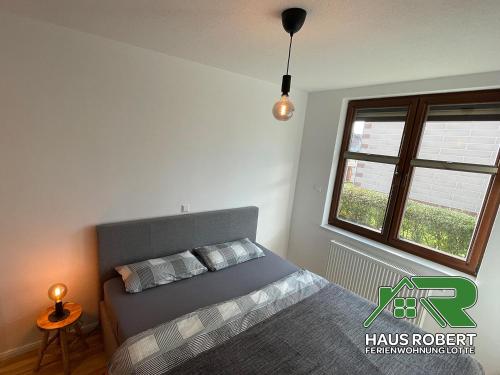 Postel nebo postele na pokoji v ubytování Ferienhaus Robert