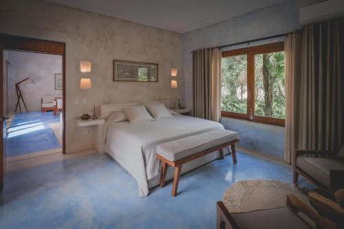 Un ou plusieurs lits dans un hébergement de l'établissement Wakax Hacienda - Cenote & Boutique Hotel - Small Luxury Hotels of the World