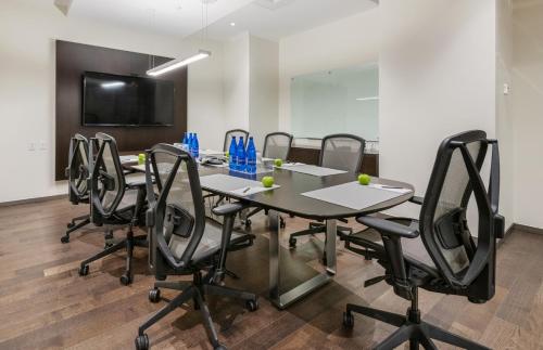 a conference room with a table and chairs at reStays Ottawa in Ottawa