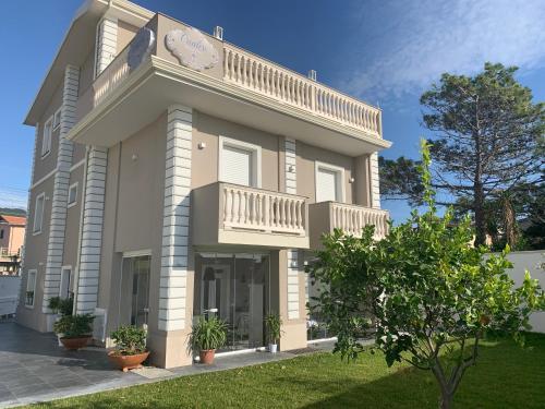 a large building with a clock on the side of it at Crialesi Boutique Rooms in Falerna