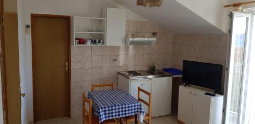 Kuchyň nebo kuchyňský kout v ubytování Apartments Zafranović