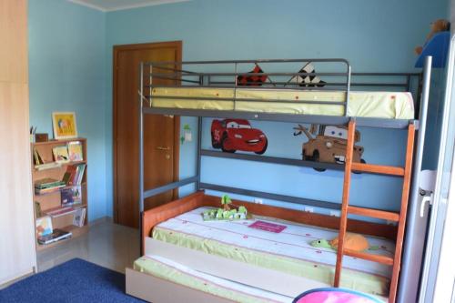 a bedroom with two bunk beds with toys on them at Kid & Holiday 2 in Katakoúli