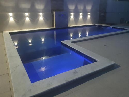 Der Swimmingpool an oder in der Nähe von Linda Casa de Praia com piscina, área verde - MOBILIADA à 150 m do mar em Tamandaré-PE