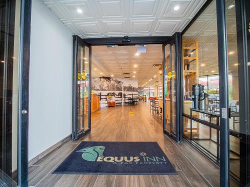 a store with a rug in the middle of a hallway at Equus Inn I75 in Ocala