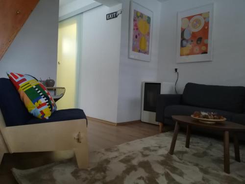 a living room with a couch and a table at ČAROBNA ŠUMA ***(magic forest) in Karlovac