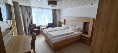 Postel nebo postele na pokoji v ubytování Hotel Anneliese