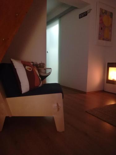 a room with a couch and a fire place at ČAROBNA ŠUMA ***(magic forest) in Karlovac
