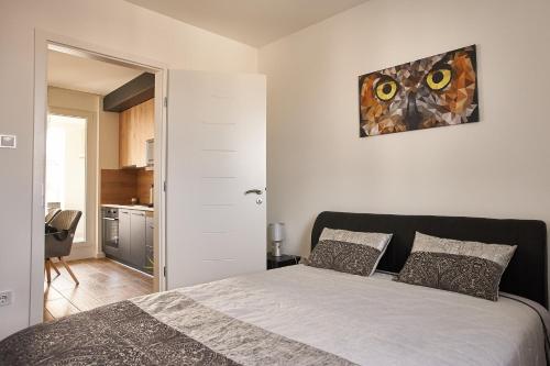 Кровать или кровати в номере SUNLIGHT SILVER Szeged - Exclusive