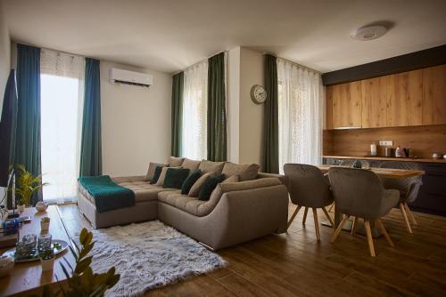 a living room with a couch and a table at SUNLIGHT SILVER Szeged - Exclusive in Szeged