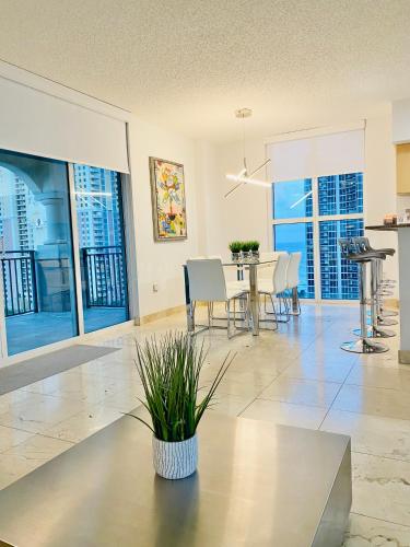 a living room with a table and chairs at The King David Condos in Miami Beach