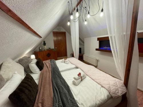 a bedroom with two beds with towels on them at Berghotel Drei Brüder Höhe in Marienberg