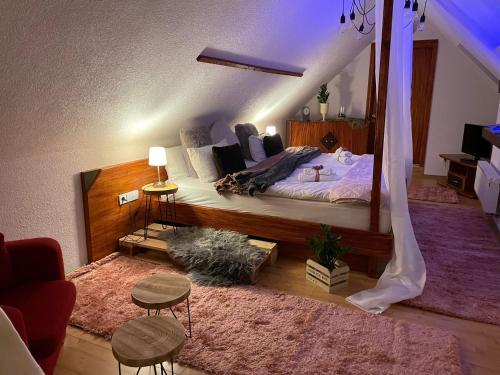 a bedroom with a large bed with a large mirror at Berghotel Drei Brüder Höhe in Marienberg