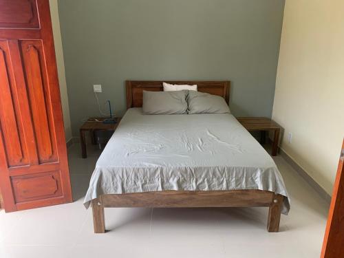 a bed in a room with two nightstands and a bed sidx sidx sidx at apartamentos Casa Amarilla in Granada