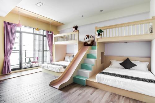 Una cama o camas en una habitación de Toutsu Asami Guest House