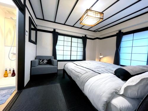 Postel nebo postele na pokoji v ubytování Nozawa Onsen BASECAMP