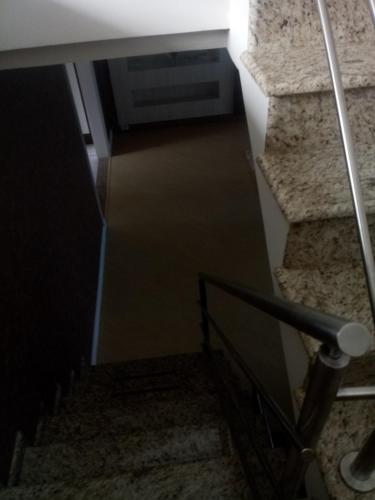a stairway with a hallway and a stair case at Sobrado in Curitiba