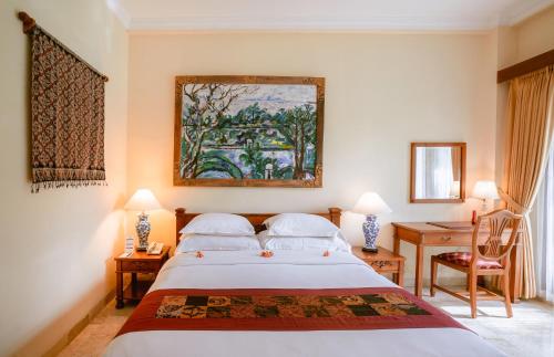 Postel nebo postele na pokoji v ubytování Hotel Kumala Pantai