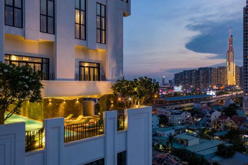 a view from the balcony of a building at night at Amanaki Thao Dien in Ho Chi Minh City