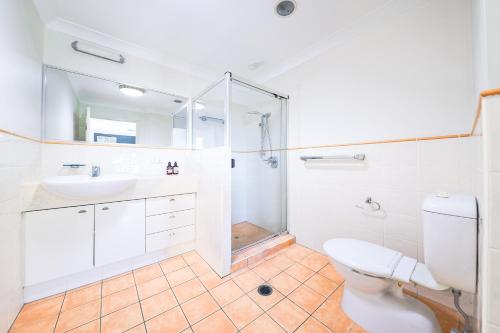 a bathroom with a toilet and a sink and a shower at Calamvale Business or Holiday like Home in Brisbane
