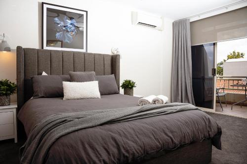 Ένα ή περισσότερα κρεβάτια σε δωμάτιο στο Mulwala Lakeside Apartment