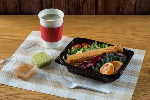 a tray of food with a salad and a cup of coffee at Hotel Regent Marine The Blue in Jeju