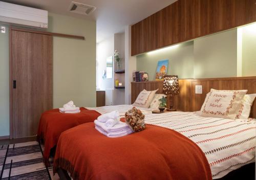 Postel nebo postele na pokoji v ubytování Miidokoro House Hotel