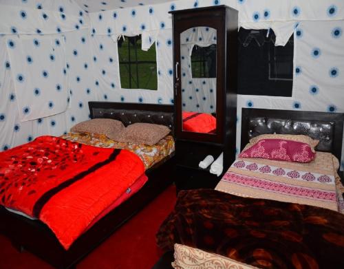 Säng eller sängar i ett rum på Camping at Birds Watching Camps