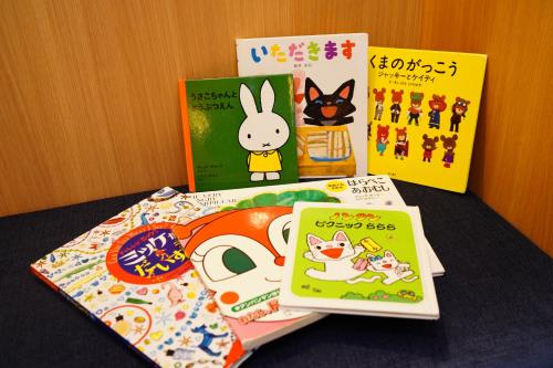 a pile of books sitting on top of a table at Richmond Hotel Tenjin Nishi-Dori in Fukuoka