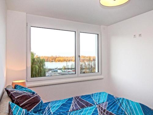 Postel nebo postele na pokoji v ubytování Ferienwohnung Donaublick mit Terrasse