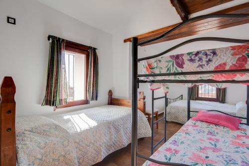 מיטה או מיטות בחדר ב-Casa Miramar