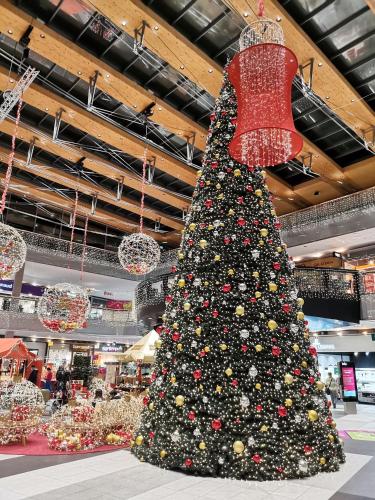a large christmas tree in a shopping mall at Landhaus Marie in Hermagor