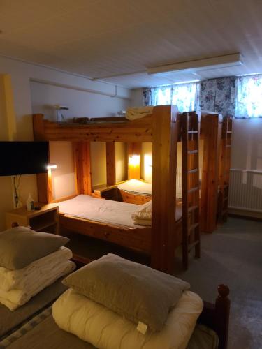 Säng eller sängar i ett rum på Vasaloppsmålet - Hostel Mora - Målkullans Vandrarhem