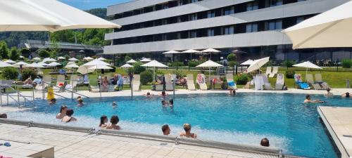 a group of people in a swimming pool at APARTMENT WALD - im Skigebiet Gerlitzen & Ossiacher See in Bodensdorf