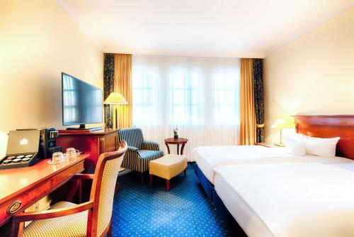 En eller flere senger på et rom på Hotel Villa Geyerswörth