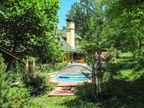 a house with a swimming pool in the yard at Holiday Home Karasova III by Interhome in Dehtáře