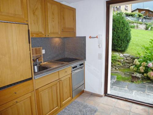 a kitchen with a sink and a stove at Apartment Nelly by Interhome in Ponto Valentino