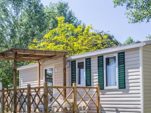 a tiny house with a wooden deck at Holiday Home Cisano & San Vito-1 by Interhome in Lazise