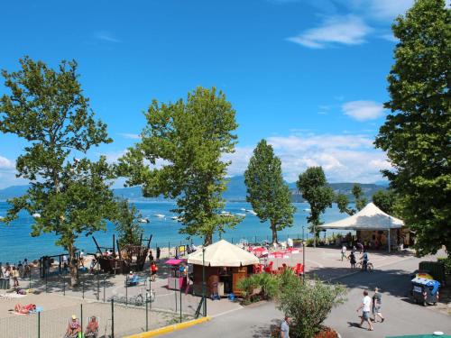 a group of people on a beach near the water at Holiday Home Cisano & San Vito-1 by Interhome in Lazise