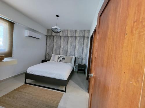 Кровать или кровати в номере ARMONIA 408 APARTMENT IN GAZCUE