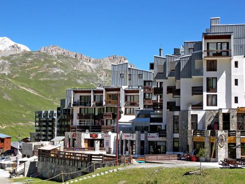 a large building with a mountain in the background at Studio Le Sefcotel - Val Claret-21 by Interhome in Tignes