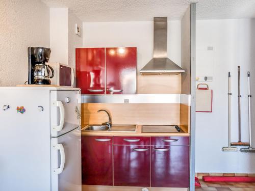 a kitchen with a sink and a refrigerator at Apartment Les Ambassades du Soleil by Interhome in Cap d'Agde