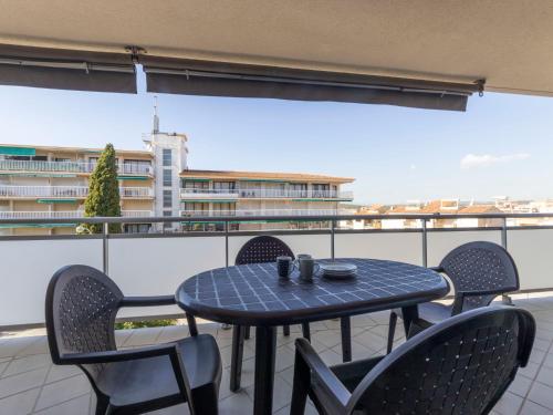 a table and chairs on a balcony with a view at Apartment Oliveres by Interhome in Torredembarra