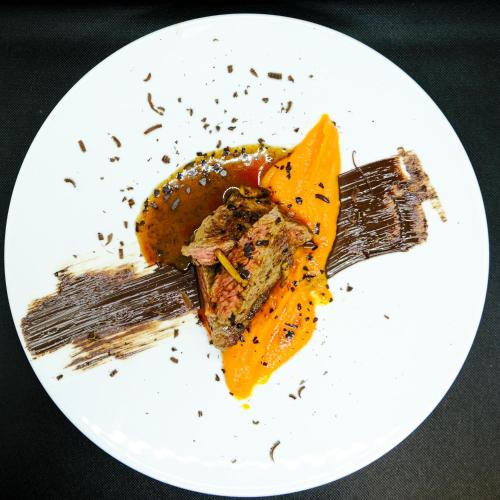 a white plate with a piece of food on it at L'Antico Uliveto in Porto Potenza Picena