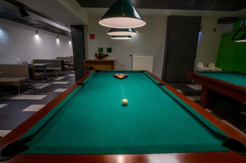 a pool table in a room with a ball on it at Penzion Hviezda in Bratislava