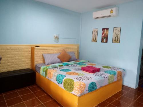 Ένα ή περισσότερα κρεβάτια σε δωμάτιο στο New Andaman Bay Bungalow