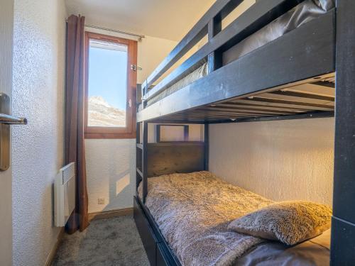 a bedroom with two bunk beds in a room at Apartment Rond Point des Pistes - Val Claret-17 by Interhome in Tignes