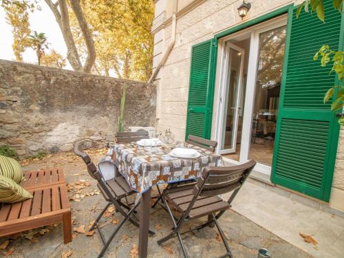 a table and chairs sitting on a patio at Apartment Alighieri by Interhome in Bolsena