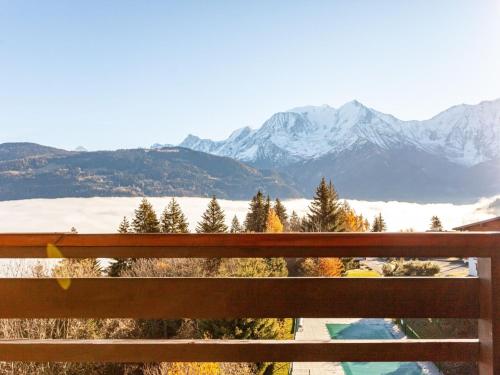 desde un banco con vistas a una cordillera nevada en Apartment La Christaz-6 by Interhome, en Saint-Gervais-les-Bains