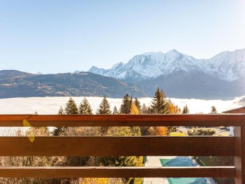a view of a snowy mountain range from a bench at Apartment La Christaz-6 by Interhome in Saint-Gervais-les-Bains